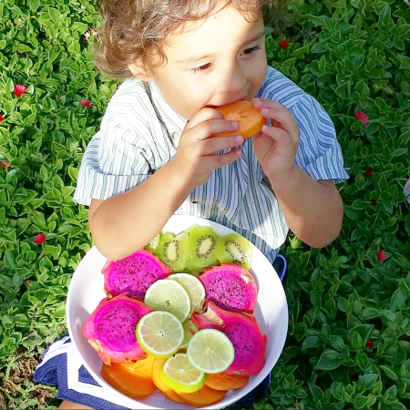 bodhi eating bowl of frui